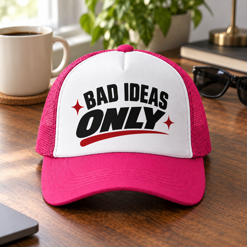 Pink and white Bad Ideas Only trucker hat on a desk